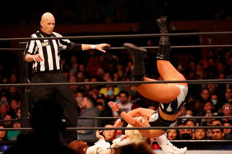 Toni Storm goes down