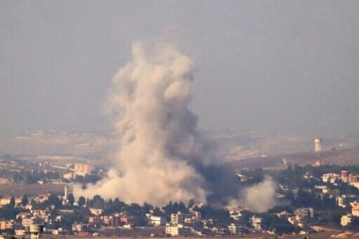 Smoke is seen rising from the site of an Israeli air strike targeting the southern Lebanese village of Kfar Tibnit