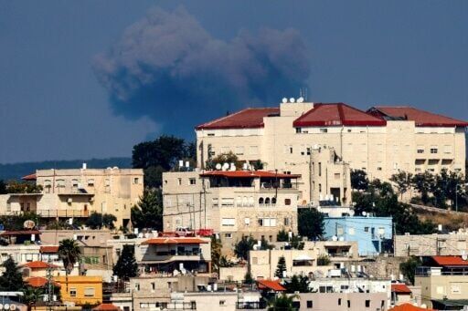 Smoke billows on the Lebanese side of the border following an Israeli air strike