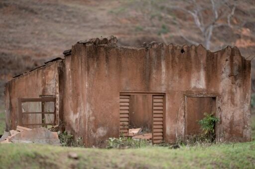 View of the remains of houses ruined by floods following the collapse of the Fundão dam in Paracatu de Baixo village, Minas Gerais state, Brazil, on October 14, 2024. Emanuele Vitoria was at home with her father and brother when a river of mud bore down...