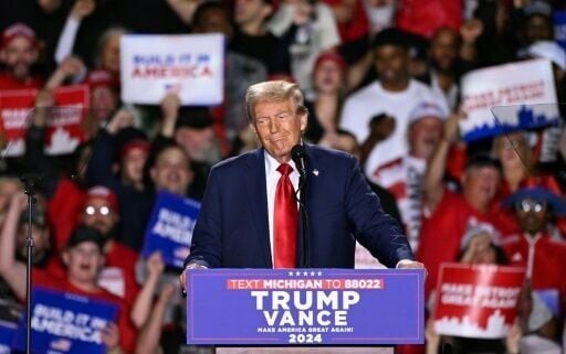 Former US President and Republican presidential candidate Donald Trump speaks during a campaign rally at Huntington Place in Detroit, Michigan, October 18, 2024
